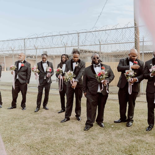 This photo provided by God Behind Bars shows prisoners at the Louisiana State Penitentiary before a father-daughter dance held inside the lockup in Angola, La., on Saturday, Nov. 22, 2025. (God Behind Bars via AP)