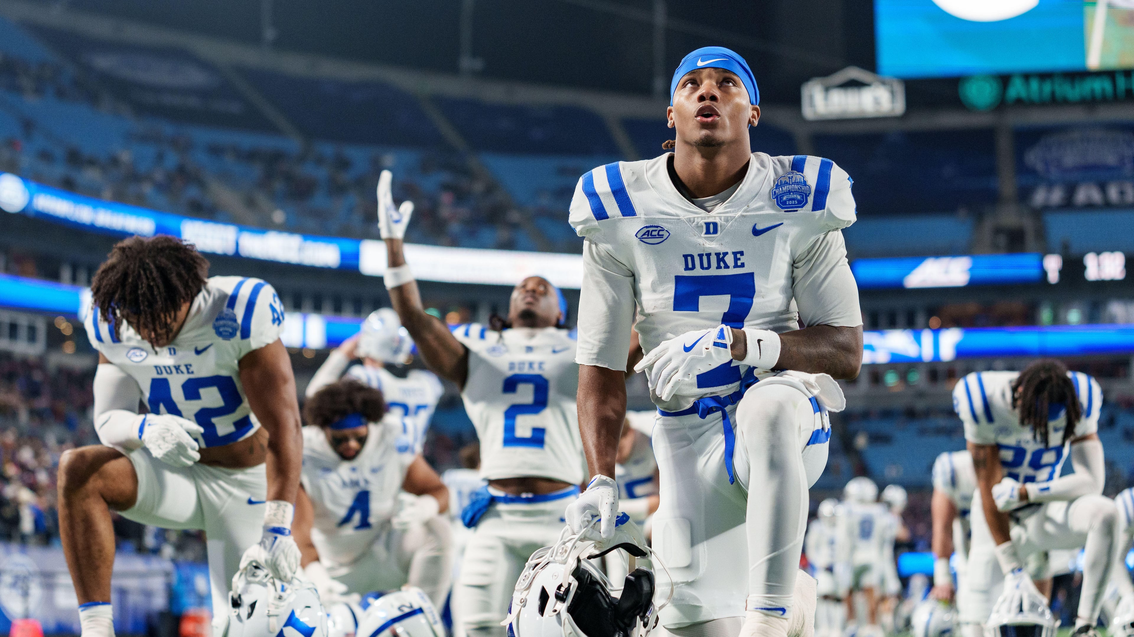 Duke wide receiver Que'Sean Brown (7) takes a knee before the Atlantic Coast Conference championship NCAA college football game against Virginia, Saturday, Dec. 6, 2025, in Charlotte, N.C. (AP Photo/Jacob Kupferman)