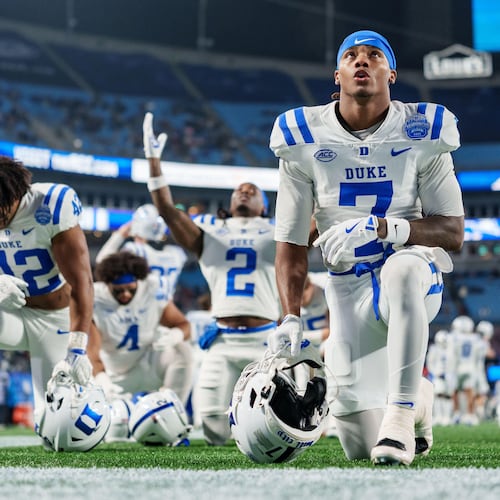 Duke wide receiver Que'Sean Brown (7) takes a knee before the Atlantic Coast Conference championship NCAA college football game against Virginia, Saturday, Dec. 6, 2025, in Charlotte, N.C. (AP Photo/Jacob Kupferman)