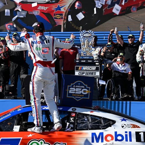 Cory Heim, center, celebrates in Victory Lane after winning a NASCAR Cup Series auto race, Sunday, June 21, 2026, in Coronado, Calif. (AP Photo/Denis Poroy)