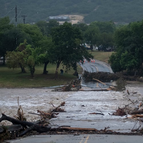 Flooding blocks off G Street along the Guadalupe River on Thursday, July 16, 2026, in Kerrville, Texas. (AP Photo/Joel Angel Juarez)
