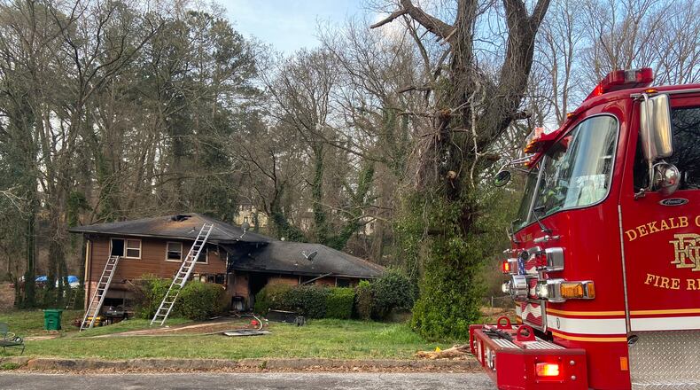 A woman is in critical condition after being pulled from a burning DeKalb County home Friday morning, officials said.