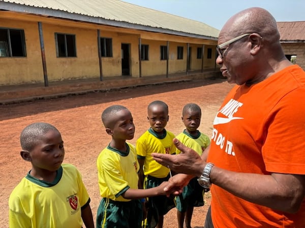 Johnbull Nwosu visits a school in Nigeria where he was born. Nwosu was disbarred from the state Supreme Court for changing a court document. (Courtesy)