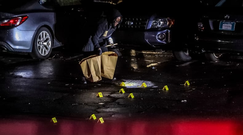 DeKalb County police collected evidence in a shooting on Maypop Lane in DeKalb County on June 20.