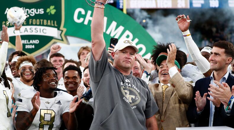 Georgia's head coach Brent Key celebrates with his team after the NCAA college football game between Georgia Tech and Florida State at the Aviva stadium in Dublin, Saturday, Aug. 24, 2024. (AP Photo/Peter Morrison)