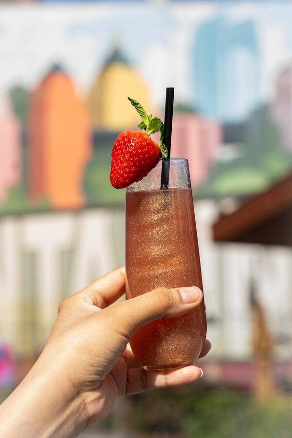 In the Azalea's Cup, O-Ku stirs together a riff on a John Daly with the addition of sake and edible glitter. (Courtesy of Vicki Artorntamarat)