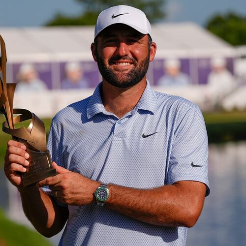 Scottie Scheffler holds the winning trophy after the final round of the St. Jude Championship golf tournament, Sunday, Aug. 16, 2026, in Memphis, Tenn. (AP Photo/George Walker IV)
