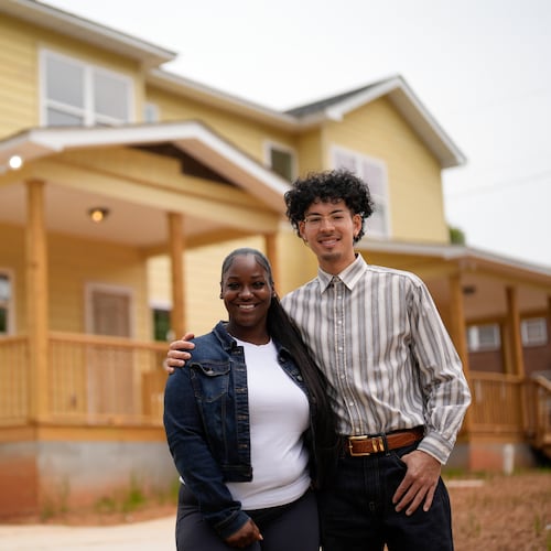 Home owners Phileena Daniel and Oswaldo Herrera pose for a photo in Langston Park, April 13, 2026, in Atlanta. (AP Photo/Mike Stewart)
