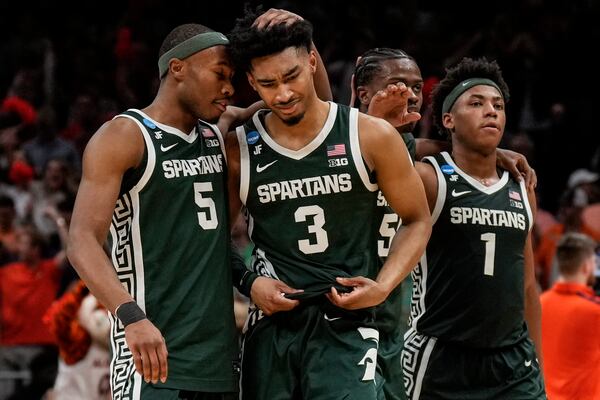 Michigan State players leave the court after losing to Auburn after the Elite Eight of the NCAA college basketball tournament, Sunday, March 30, 2025, in Atlanta. (AP Photo/George Walker IV)
