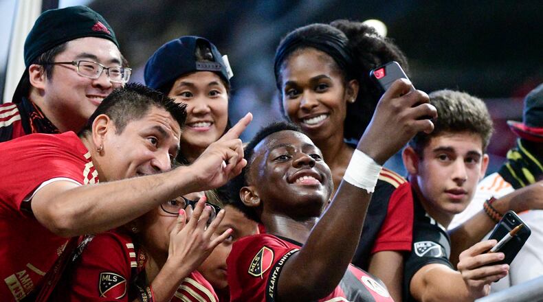 Atlanta United defender George Bello takes a selfie with fans after an MLS soccer game against the New England Revolution, Saturday, Oct. 6, 2018. Atlanta won 2-1. (John Amis)
