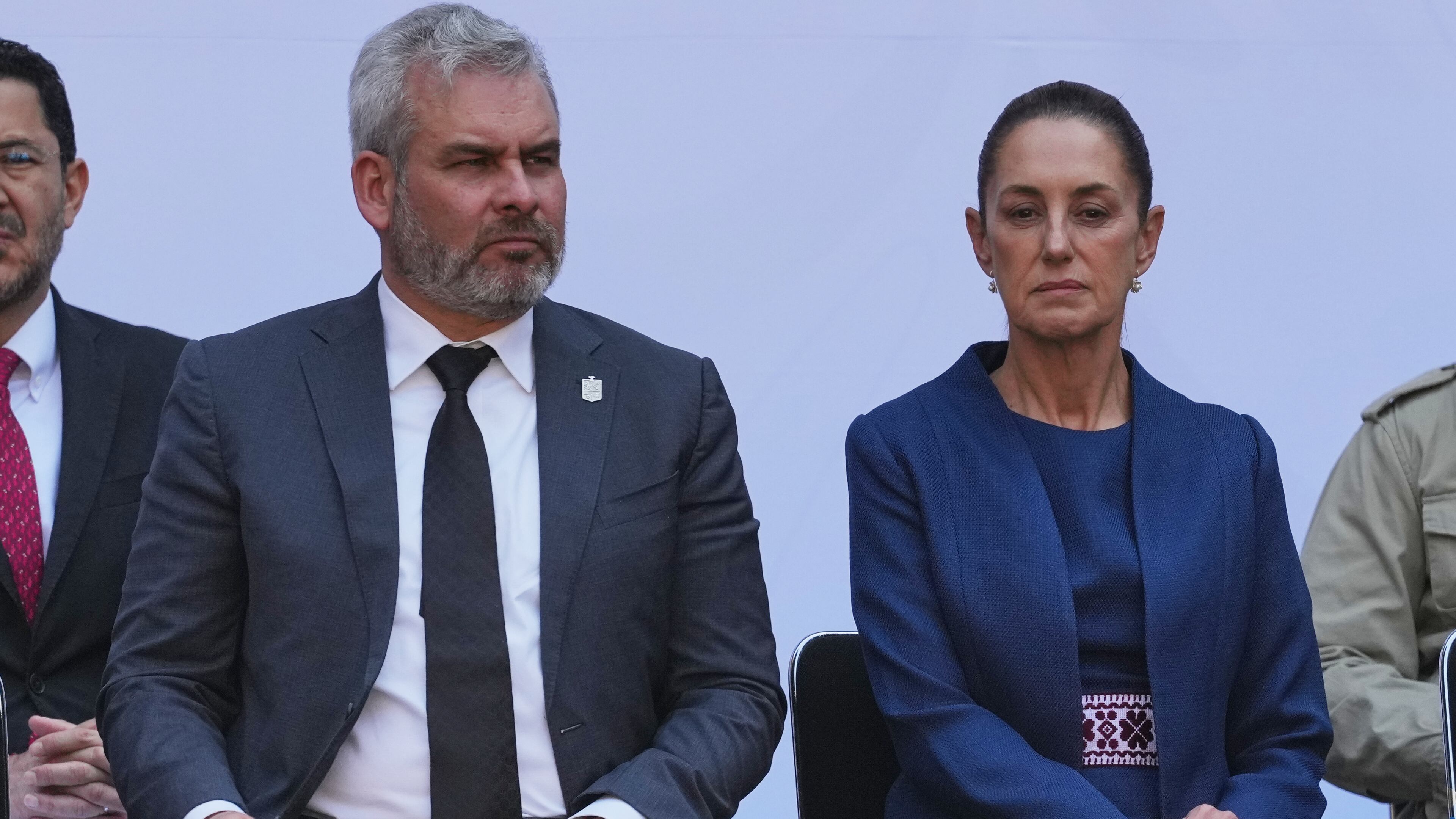FILE - Michoacán State Governor Alfredo Ramirez Bedolla, left, and Mexican President Claudia Sheinbaum attend a presentation of the new security strategy against violence for the state of Michoacan, at the National Palace in Mexico City, Nov. 9, 2025. (AP Photo/Claudia Rosel, File)