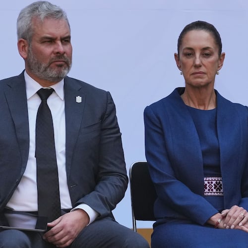 FILE - Michoacán State Governor Alfredo Ramirez Bedolla, left, and Mexican President Claudia Sheinbaum attend a presentation of the new security strategy against violence for the state of Michoacan, at the National Palace in Mexico City, Nov. 9, 2025. (AP Photo/Claudia Rosel, File)