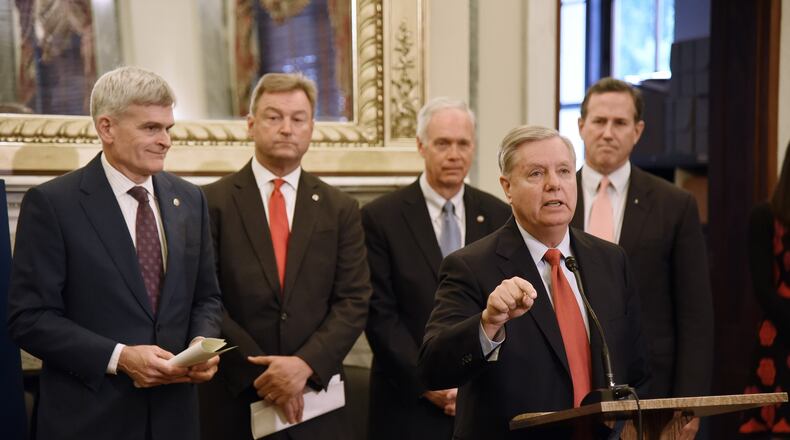 U.S. Sen. Lindsey Graham (R-S.C.) speaks as Sen. Bill Cassidy (R-La.), Sen. Dean Heller (R-Nev.), Sen. Ron Johnson (R-Wis.) listen during a news conference on health care on Wednesday, Sept. 13, 2017 on Capitol Hill in Washington, D.C. (Olivier Douliery/Abaca Press/TNS)