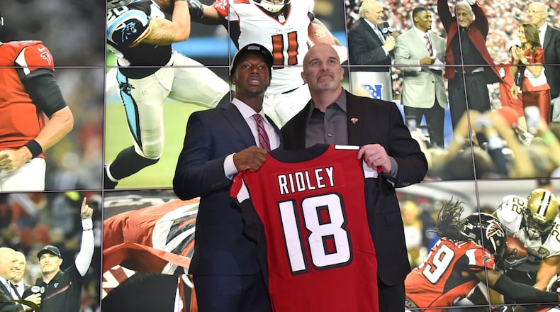 Falcons first-round pick Calvin Ridley poses with coach Dan Quinn during a press conference at the Falcons’ training facility. The former Alabama wide receiver was selected by the Falcons with the 26th pick of the first round.