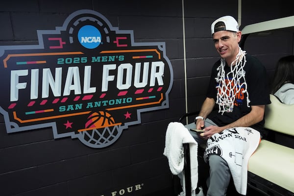Florida head coach Todd Golden rides to the locker room after their win against the Houston in the national championship at the Final Four of the NCAA college basketball tournament, Monday, April 7, 2025, in San Antonio. (AP Photo/Eric Gay)