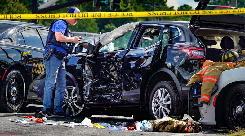 A driver was shot and killed by a Cobb County police officer Wednesday afternoon on Powder Springs Road in Marietta, authorities said.