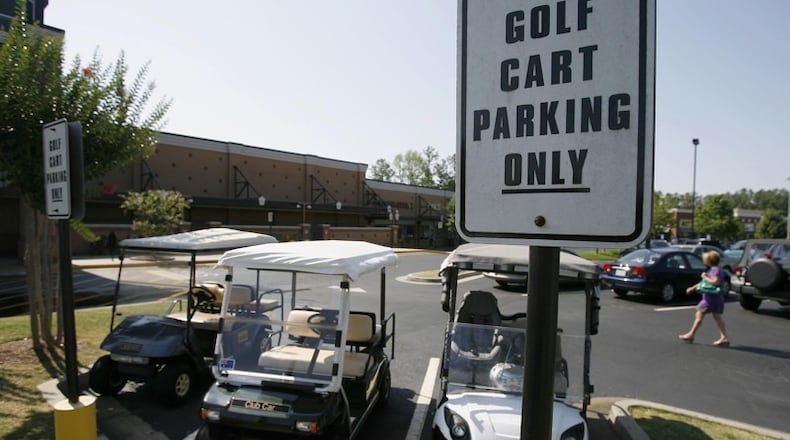 Golf carts modified to operate on city streets would be allowed in Woodstock under an ordinance pending before the City Council. AJC FILE