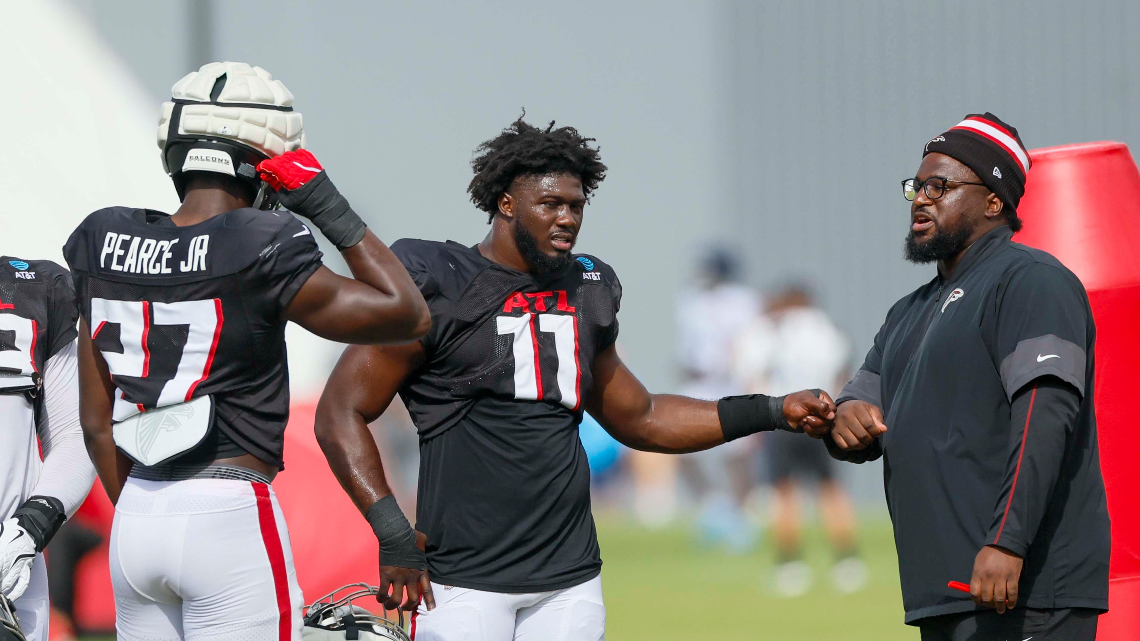 Atlanta Falcons rookies Jalon Walker and James Pearce Jr. combined to make a big play that changed the game from a blowout loss into one that could've easily been a Falcons win. (Miguel Martinez/AJC)