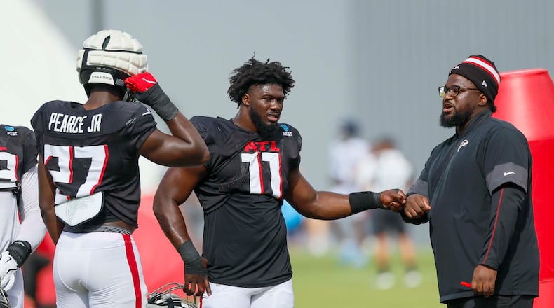 Atlanta Falcons rookies Jalon Walker and James Pearce Jr. combined to make a big play that changed the game from a blowout loss into one that could've easily been a Falcons win. (Miguel Martinez/AJC)