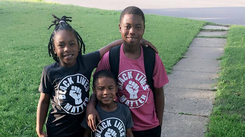In an undated image provided by Jordan Herbert, from left, Bentlee Herbert, 8; Rodney Herbert, 5; and Jaelon Herbert, 12, wearing Black Lives Matter T-shirts. Two of the brothers were removed from their Oklahoma elementary school classrooms this past week and made to wait out the school day in a front office for wearing T-shirts that read “Black Lives Matter,” according to the boys’ mother.
