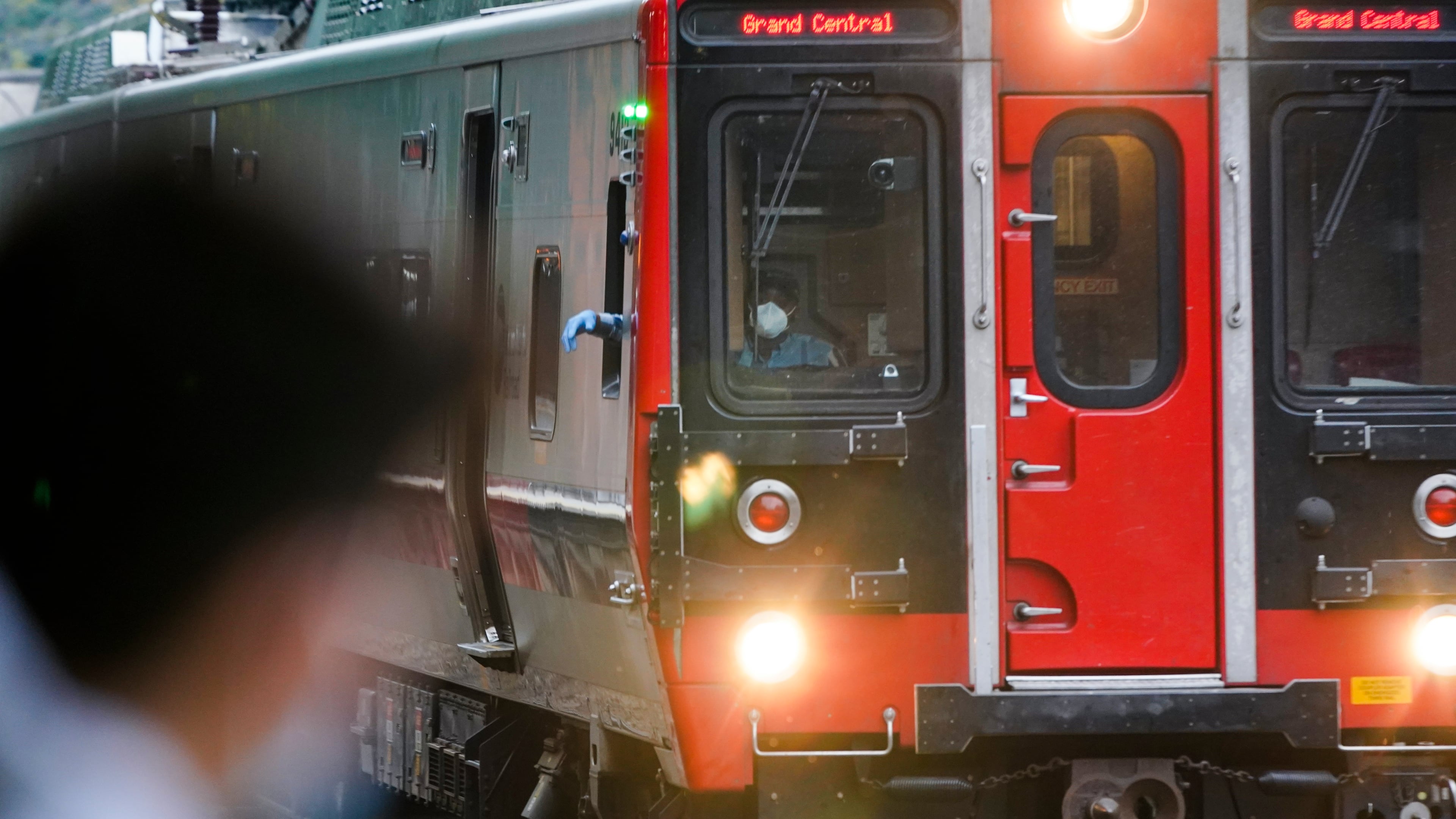 FILE - A train operator watches a train at the Fordham Metro North station Thursday, Oct. 22, 2020, in New York. (AP Photo/Frank Franklin II, File)