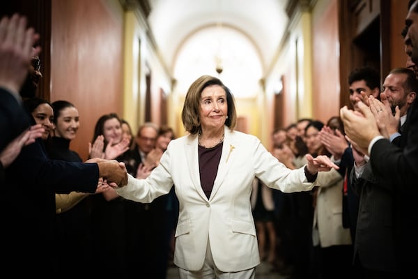 Nancy Pelosi, D-Calif., was greeted by staff in Washington after she announced she was stepping down as Democratic leader of the House. (Erin Schaff/The New York Times)