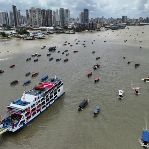 People riding in boats participate in a People's Summit event on Guajara Bay during the COP30 U.N. Climate Summit, Wednesday, Nov. 12, 2025, in Belem, Brazil. (AP Photo/Andre Penner)