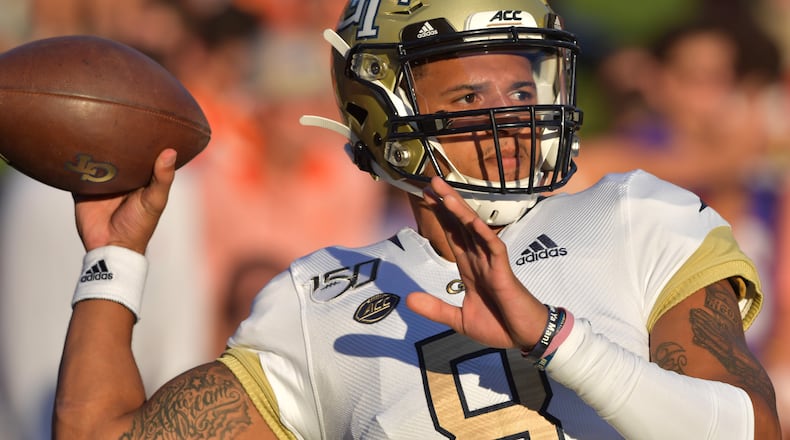 Georgia Tech quarterback Tobias Oliver (8) warms up before their game against the Clemson at Memorial Stadium on the Clemson University campus in Clemson, S.C. on Thursday, August 29, 2019. Georgia Tech took the field for the first time with Geoff Collins as head coach. (Hyosub Shin / Hyosub.Shin@ajc.com)