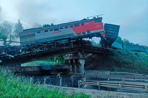 This photo released by Acting Governor of the Kursk Region Alexander Khinshtein telegram channel on Sunday, June 1, 2025, shows a view of a damaged bridge after the crash of a freight train in Russia's Kursk region, which borders Ukraine. (Acting Governor of the Kursk Region Alexander Khinshtein via AP)
