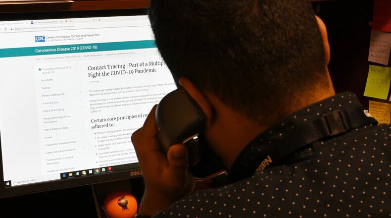 State epidemiologist Curtis Sarkar works by phone out of the East Metro Health District office in Lawrenceville. Most contact tracing work for the coronavirus, considered key to reopening Georgia, will be done over the phone or through a new online platform, given social distancing guidelines and the need for speed. HYOSUB SHIN / HYOSUB.SHIN@AJC.COM