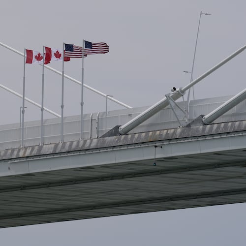 FILE - Canadian and American flags are shown on the Gordie Howe Bridge under construction between Windsor, Ontario and Detroit, May 22, 2026. (AP Photo/Paul Sancya, File)