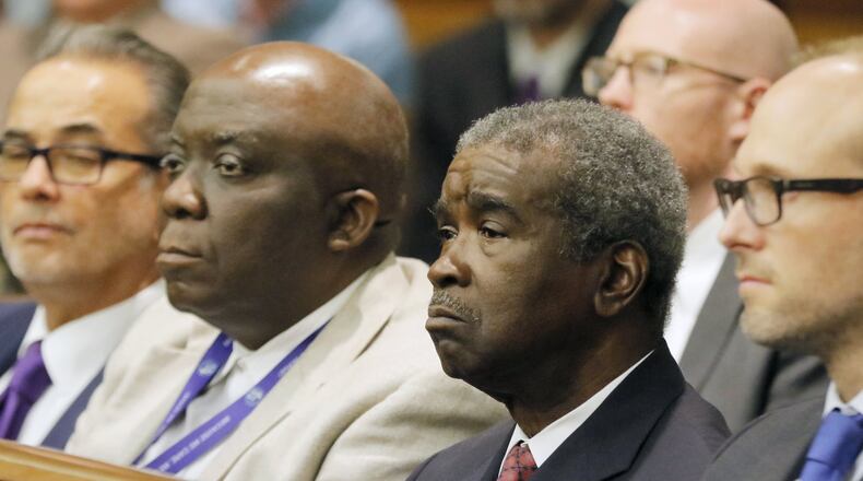 Dr. Arthur Ferdinand (second from right), Fulton County Tax Commissioner, continues to collect property tax money. Property taxes are due Monday. BOB ANDRES /BANDRES@AJC.COM AJC FILE PHOTO