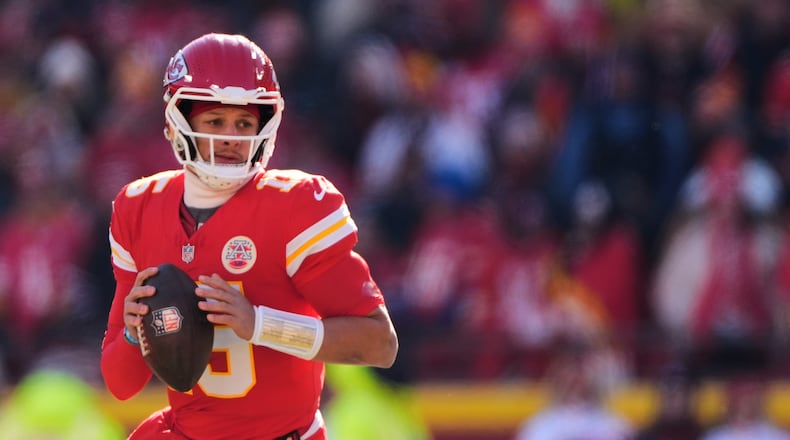 FILE - Kansas City Chiefs quarterback Patrick Mahomes looks to pass during the first half of an NFL football game against the Los Angeles Chargers, Dec. 14, 2025, in Kansas City, Mo. (AP Photo/Charlie Riedel, File)