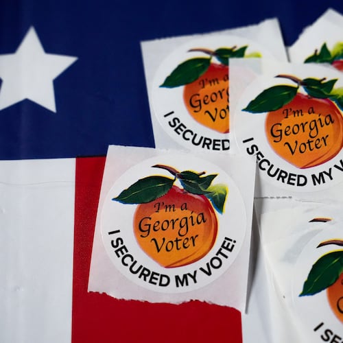 FILE - Stickers lay on a table inside a polling place, Nov. 5, 2024, in Atlanta. (AP Photo/Brynn Anderson, File)