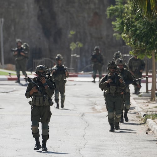Israeli army soldiers patrol the streets of the occupied West Bank village of Qusra, south of Nablus, Thursday, Aug. 13, 2026. (AP Photo/Majdi Mohammed)