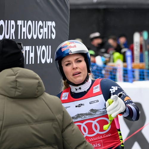 United States' Lindsey Vonn at the finish area after crashing, during an alpine ski, women’s World Cup downhill, in Crans Montana, Switzerland, Friday, Jan. 30, 2026. (Alessandro Della Valle/Keystone via AP)