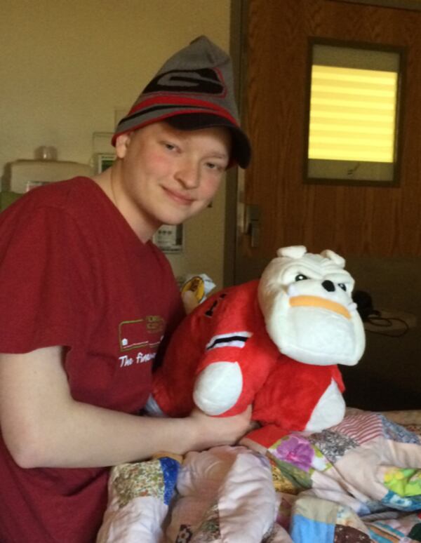 Michael Torpy and UGA Bulldog paraphernalia while fighting cancer at Children's Healthcare in 2017. Bill Torpy photo