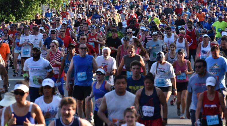 Runners approach Cardiac Hill during the AJC Peachtree Road Race on Wednesday, July 4, 2018. HYOSUB SHIN/HSHIN@AJC.COM
