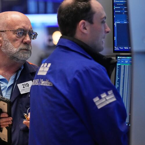 Trader Joseph Stevens, left, works on the floor of the New York Stock Exchange, Tuesday, May 5, 2026. (AP Photo/Richard Drew)