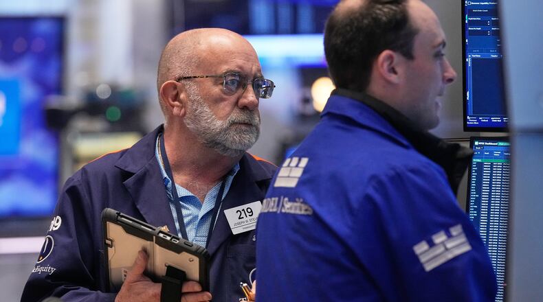 Trader Joseph Stevens, left, works on the floor of the New York Stock Exchange, Tuesday, May 5, 2026. (AP Photo/Richard Drew)