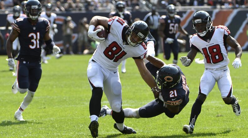 Falcons tight end Austin Hooper (81) takes down Chicago’s Quintin Demps (21) on his way to the end zone during an 88-yard touchdown catch in the fourth quarter Sunday, Sept. 10, 2017, at Soldier Field on  in Chicago.