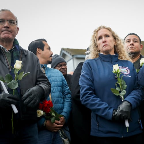 Stockton Mayor Christina Fugazi joins a vigil near the site at Thornton Blvd. and Lucile Ave., where a mass shooting took place Saturday at a banquet hall in Stockton, Calif., Sunday, Nov. 30, 2025. (Brontë Wittpenn/San Francisco Chronicle via AP)