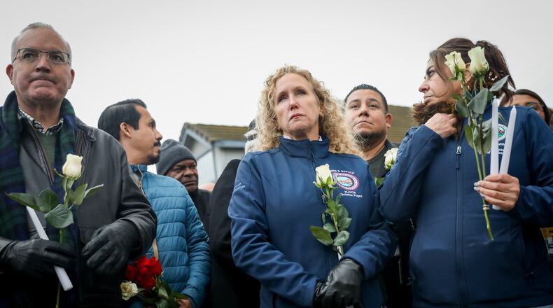 Stockton Mayor Christina Fugazi joins a vigil near the site at Thornton Blvd. and Lucile Ave., where a mass shooting took place Saturday at a banquet hall in Stockton, Calif., Sunday, Nov. 30, 2025. (Brontë Wittpenn/San Francisco Chronicle via AP)
