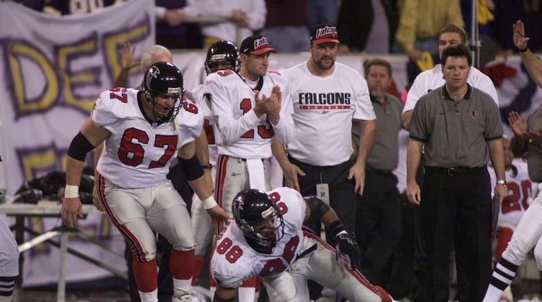 O.J. Santiago gets up after a 26-yard reception which was the third play of the Falcons final drive. (BEN GRAY/STAFF)
Atlanta Falcons quarterback Chris Chandler (cq) scrambles past the Vikings Tony Williams (cq) during the Falcons' final scoring drive in overtime. (BEN GRAY/STAFF)