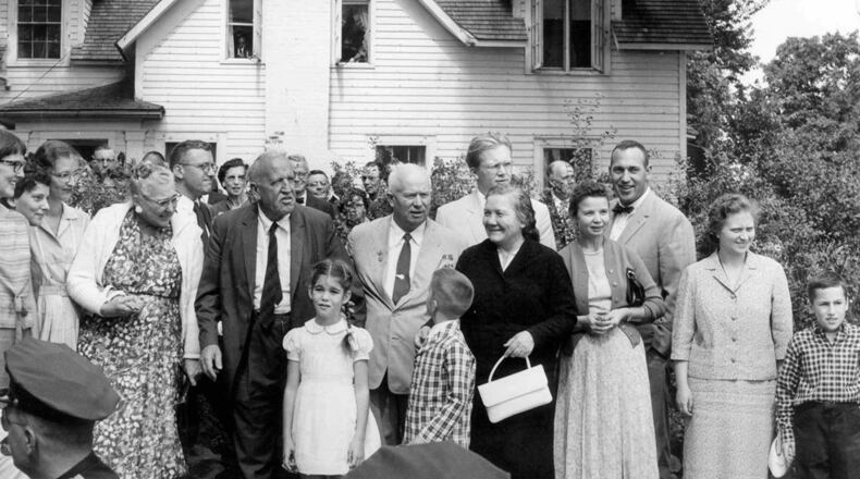 Left to right: Elizabeth Garst, Roswell Garst, Nikita Khrushchev, Nina Khrushchev and daughters Julia and Randa Khrushchev, stand in front of the Garst home during Krushchev's visit, Sept. 23, 1959, in Coon Rapids, Iowa. Elizabeth Garst, front left, then 8 years old, is now turning her grandparents farmhouse into a bed and breakfast.