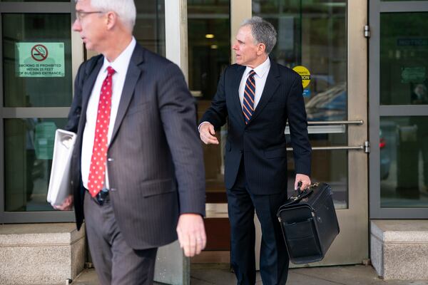 Mark Hansen, right, a lawyer for Meta, departs following the first day of a historic antitrust trial about Meta CEO Mark Zuckerberg intentions in acquiring Instagram, at Barrett Prettyman United States Court House in Washington, Monday, April 14, 2025. (AP Photo/Nathan Howard)