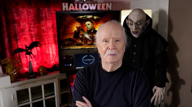 FILE - Author-filmmaker John Carpenter appears at his office in Los Angeles on Oct. 3, 2023. (AP Photo/Chris Pizzello, File)