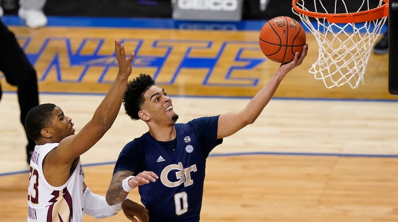 Georgia Tech guard Michael Devoe drives to the basket for two points during Saturday's ACC championship game against Florida State.