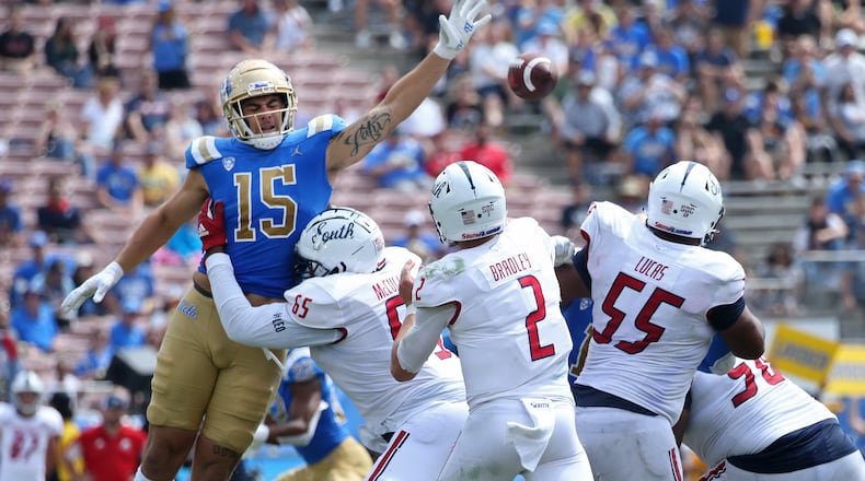 UCLA linebacker Laiatu Latu (15) pressures South Alabama quarterback Carter Bradley (2) during the third quarter at the Rose Bowl on Saturday, Sept. 17, 2022, in Pasadena, California. (Myung J. Chun/Los Angeles Times/TNS)
