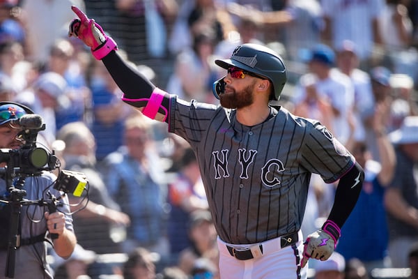 New York Mets' Brandon Nimmo celebrates after his grand slam during the first inning of a baseball game against the New York Yankees, Saturday, July 5, 2025, in New York. (AP Photo/Angelina Katsanis)